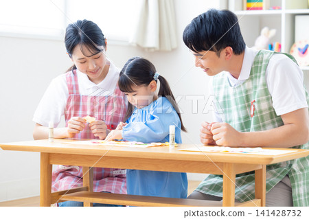 Childcare image: A girl and a childcare worker who work Childcare image: A girl and a childcare worker who work 141428732