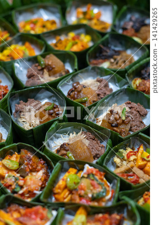 Indonesian Rice Meals Wrapped in Banana Leaf Indonesian Rice Meals Wrapped in Banana Leaf 141429265