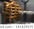 Stacked chairs and tables 141429535