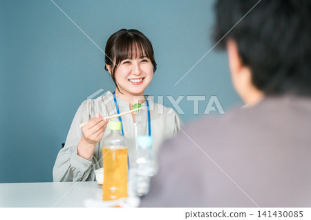 Businesswoman having lunch in company cafeteria/break room 141430085