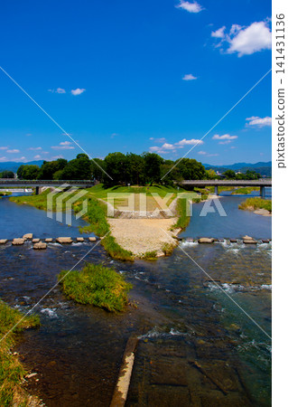 Kamogawa Delta: The confluence of the Kamogawa and Takasegawa rivers, a pilgrimage site for fans. Kamogawa Delta: The confluence of the Kamogawa and Takasegawa rivers, a pilgrimage site for fans. 141431136