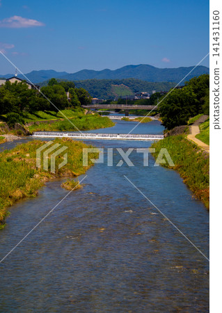 Kamogawa Delta: The confluence of the Kamogawa and Takasegawa rivers, a pilgrimage site for fans. Kamogawa Delta: The confluence of the Kamogawa and Takasegawa rivers, a pilgrimage site for fans. 141431160