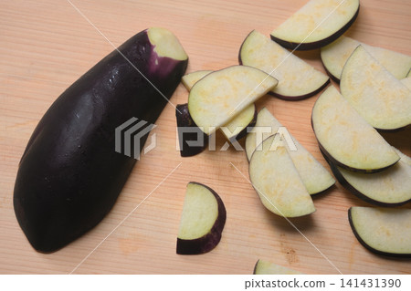 Eggplant cut on a cutting board Eggplant cut on a cutting board 141431390