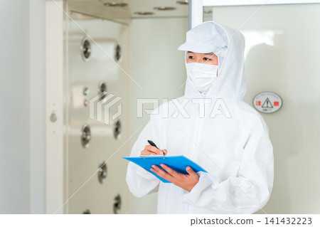 People who work in factories with air showers and clean rooms People who work in factories with air showers and clean rooms 141432223