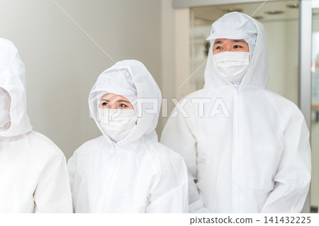People who work in factories with air showers and clean rooms People who work in factories with air showers and clean rooms 141432225