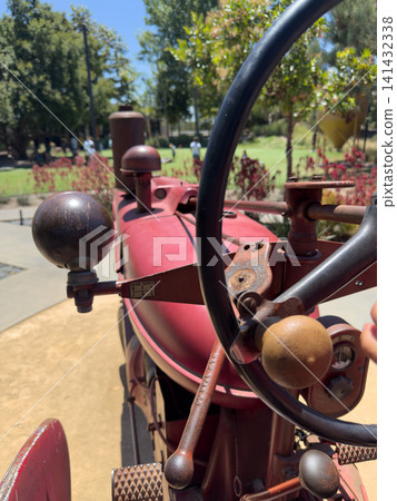 Vintage red tractor, vehicle Machine that reflects agricultural history Vintage red tractor, vehicle Machine that reflects agricultural history 141432338