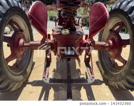 Vintage red tractor, vehicle Machine that reflects agricultural history Vintage red tractor, vehicle Machine that reflects agricultural history 141432360