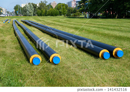 Pre-insulated district heating pipes prepared for underground utility installation in urban infrastructure project Pre-insulated district heating pipes prepared for underground utility installation in urban infrastructure project 141432516