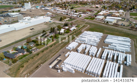 Aerial View Of Grain Elevator And Storage Warehouses At Town Crossroads Aerial View Of Grain Elevator And Storage Warehouses At Town Crossroads 141433874
