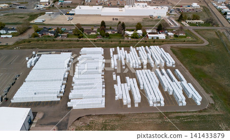 Top Down Aerial View Of Storage Yard Rows Near Industrial Warehouse Top Down Aerial View Of Storage Yard Rows Near Industrial Warehouse 141433879