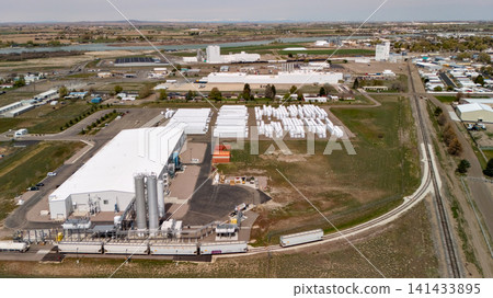 Aerial View Of Industrial Plant With Silos And Railway Line Aerial View Of Industrial Plant With Silos And Railway Line 141433895