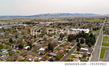 Aerial View Of Residential Neighborhood With Mountain Backdrop And Roads Aerial View Of Residential Neighborhood With Mountain Backdrop And Roads 141433922