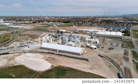 Aerial View Of Industrial Facility With Railway Tracks And Town Aerial View Of Industrial Facility With Railway Tracks And Town 141433975