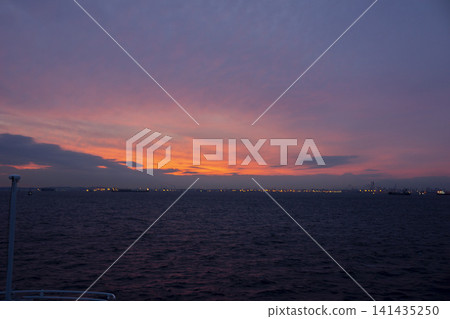 A sunset paints Tokyo Bay in crimson. A sunset paints Tokyo Bay in crimson. 141435250