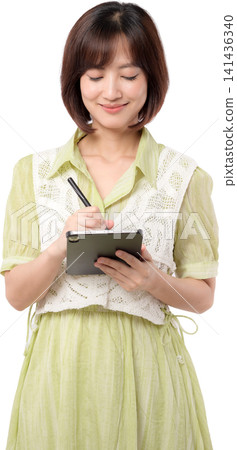 Asian woman transparent background tablet pen writing focused happy portrait isolated studio work creative design digital graphic professional style outfit green clothing. PNG file format Asian woman transparent background tablet pen writing focused happy portrait isolated studio work creative design digital graphic professional style outfit green clothing. PNG file format 141436340