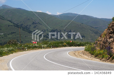 Mountain pass road with scenic views, no animals or named plants visible Mountain pass road with scenic views, no animals or named plants visible 141436849