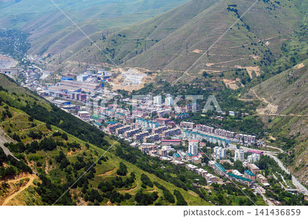 Aerial view of small Kajaran town surrounded by rolling hills Aerial view of small Kajaran town surrounded by rolling hills 141436859