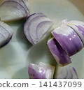 Fresh red onion slices prepared for cooking on a light background. Fresh red onion slices prepared for cooking on a light background. 141437099