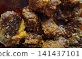 Rich and spicy slow cooked beef curry with red chili oil. Rich and spicy slow cooked beef curry with red chili oil. 141437101