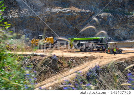 Excavation site with heavy equipment Excavation site with heavy equipment 141437796