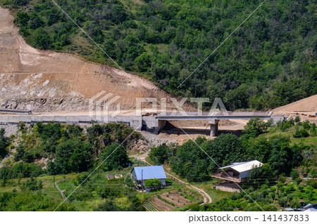 Overlook view of concrete bridge crossing rural area Overlook view of concrete bridge crossing rural area 141437833