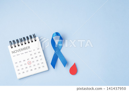 World Diabetes Day concept, November 14 calendar with Blue ribbon with a red blood drop on light blue background World Diabetes Day concept, November 14 calendar with Blue ribbon with a red blood drop on light blue background 141437950