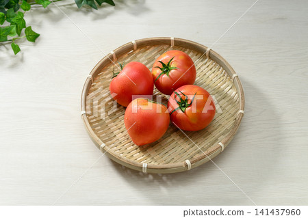 Fresh, ripe tomatoes served in a bamboo basket Fresh, ripe tomatoes served in a bamboo basket 141437960