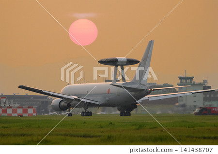 A Japan Air Self-Defense Force E-767 early warning and control aircraft takes off at dusk. A Japan Air Self-Defense Force E-767 early warning and control aircraft takes off at dusk. 141438707