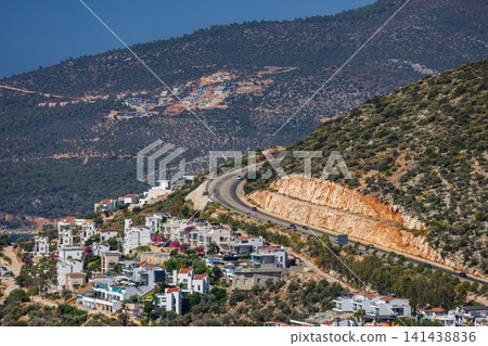 Picturesque coastal town Kalkan perched on a sunny hillside Picturesque coastal town Kalkan perched on a sunny hillside 141438836