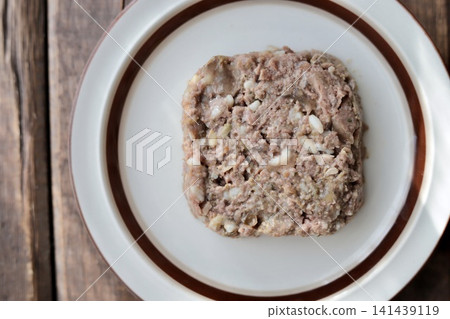 Wet dog food with brown rice served in a bowl 141439119
