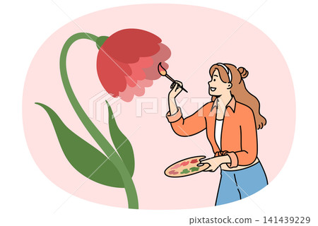 Woman artist paints flower on wall to decorate interior, uses wooden palette and brush Woman artist paints flower on wall to decorate interior, uses wooden palette and brush 141439229