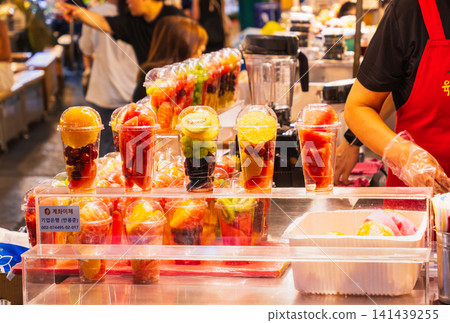 Freshly squeezed fruit juice from Gwangjang Market in Seoul Freshly squeezed fruit juice from Gwangjang Market in Seoul 141439255