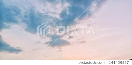 Soft twilight behind blue clouds Soft twilight behind blue clouds 141439257