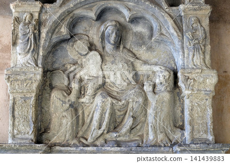 Virgin Mary with baby Jesus, relief in the Santa Maria Novella Principal Dominican church in Florence, Italy Virgin Mary with baby Jesus, relief in the Santa Maria Novella Principal Dominican church in Florence, Italy 141439883