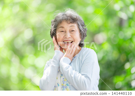 Senior woman, fresh greenery, smile Senior woman, fresh greenery, smile 141440110