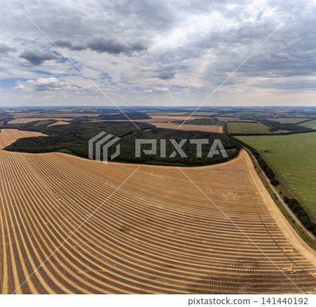 Aerial harvested golden wheat farmland fields Aerial harvested golden wheat farmland fields 141440192