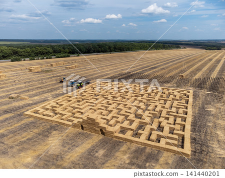 Aerial View of Hay Bale Maze on Agriculture Field Aerial View of Hay Bale Maze on Agriculture Field 141440201