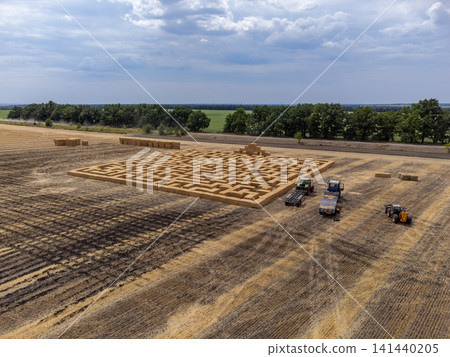 Aerial View of Harvested Field with Hay Bale Maze Aerial View of Harvested Field with Hay Bale Maze 141440205