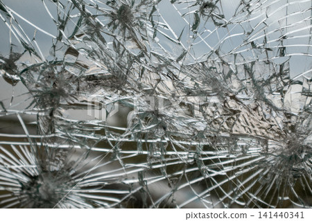 Shattered Window with Cracked Radial Glass Pattern Shattered Window with Cracked Radial Glass Pattern 141440341