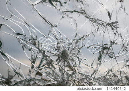 Fractured Glass Window with Cracked Web Pattern 141440342