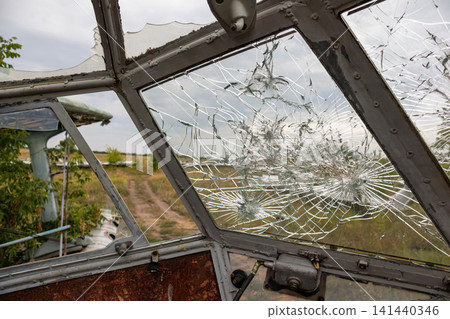 Shattered Cockpit Window of Abandoned Aircraft Shattered Cockpit Window of Abandoned Aircraft 141440346
