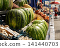 Lots of watermelons in the city market. 141440703