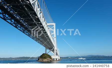 A gigantic suspension bridge viewed from below. A gigantic suspension bridge viewed from below. 141440758