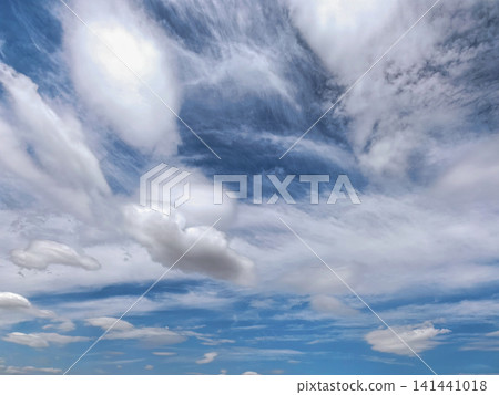 Dramatic White Clouds Across Deep Blue Summer Sky Dramatic White Clouds Across Deep Blue Summer Sky 141441018