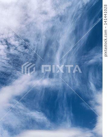 Wispy Cirrus Clouds Against Deep Blue Summer Sky Wispy Cirrus Clouds Against Deep Blue Summer Sky 141441028