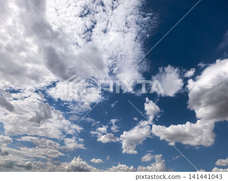 Blue Summer Sky with Scattered White Cumulus Clouds Blue Summer Sky with Scattered White Cumulus Clouds 141441043