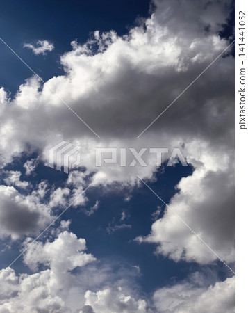 Massive Towering Cumulus Clouds in Dramatic Summer Sky Massive Towering Cumulus Clouds in Dramatic Summer Sky 141441052
