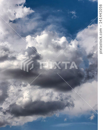Dark Storm Clouds Building Beneath Bright White Cumulus Dark Storm Clouds Building Beneath Bright White Cumulus 141441056