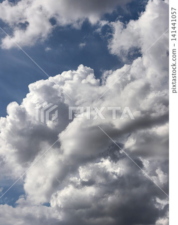 Massive Billowing Cumulus Clouds Filling Dramatic Blue Sky Massive Billowing Cumulus Clouds Filling Dramatic Blue Sky 141441057