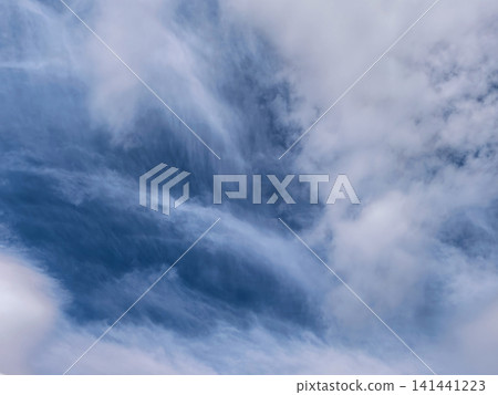 Dramatic Layered Clouds Over Open Blue Horizon Dramatic Layered Clouds Over Open Blue Horizon 141441223
